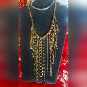 Long multi chains unusual necklace. Adjustable but cover chest in low cut tops.